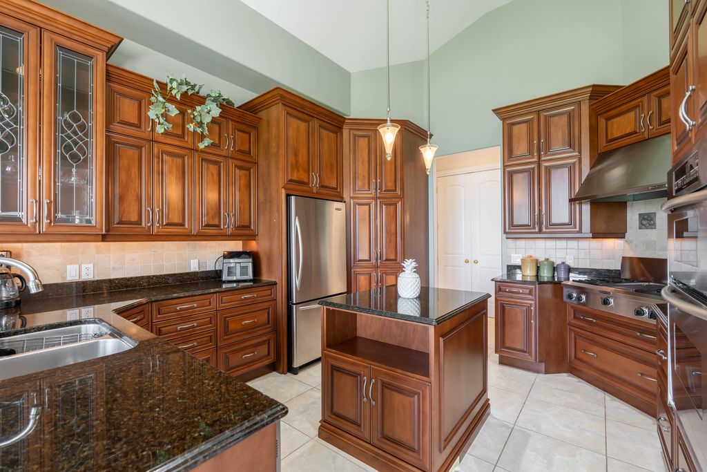 Bright, decluttered kitchen with clean countertops prepared for real estate photography.