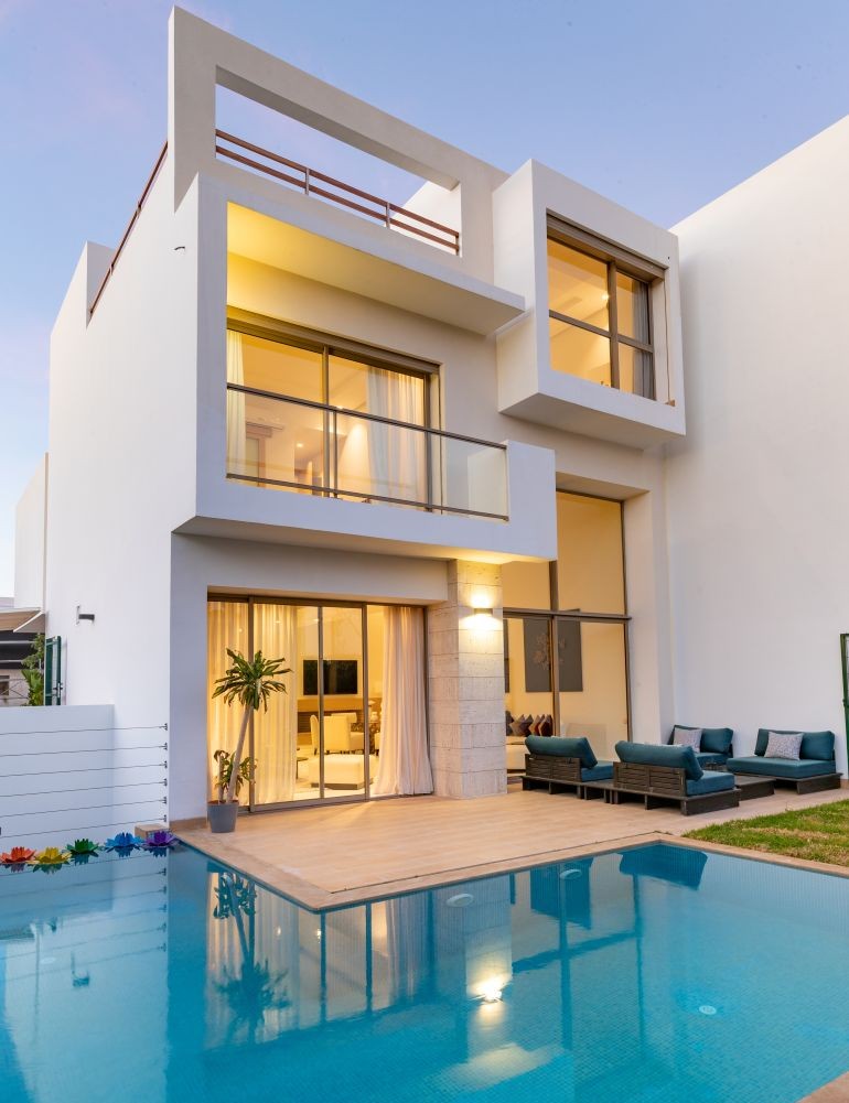 Design luxury villa, garden and pool with plants and relaxation area, trendy white, blue and green colors (1)