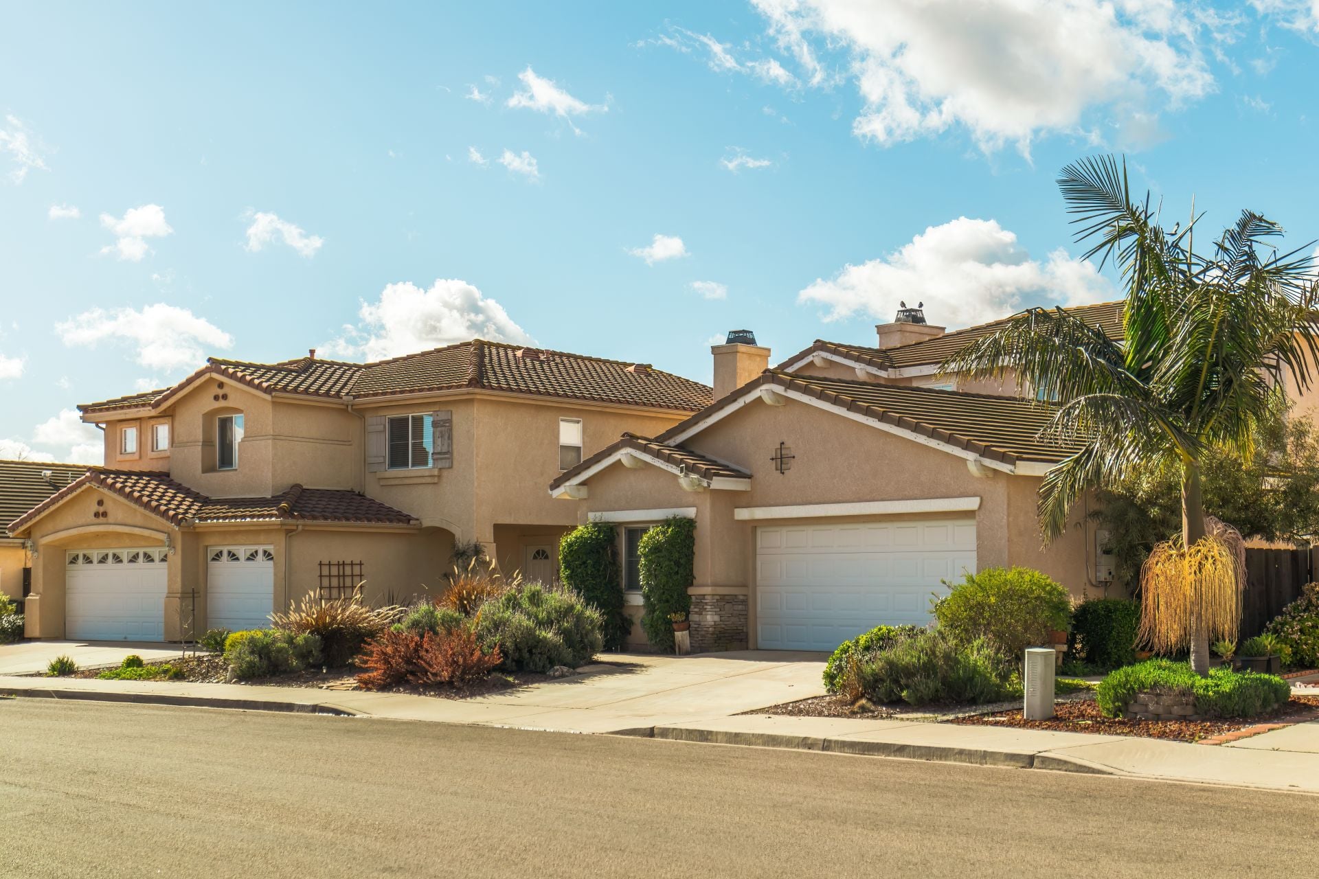 Beautiful houses with nicely landscaped front the yard in small town in California.