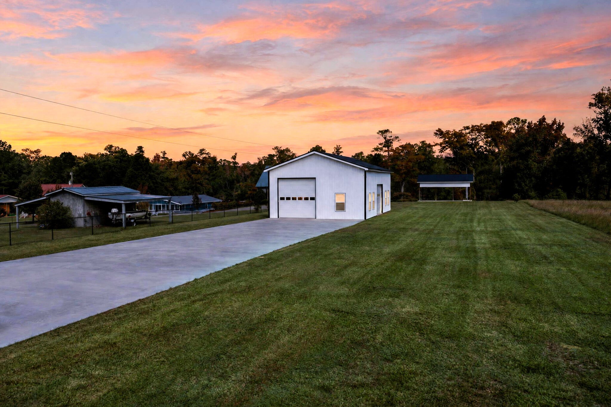Twilight view down the concrete drive to the metal shop, 11 Gulley Ln, Salters SC