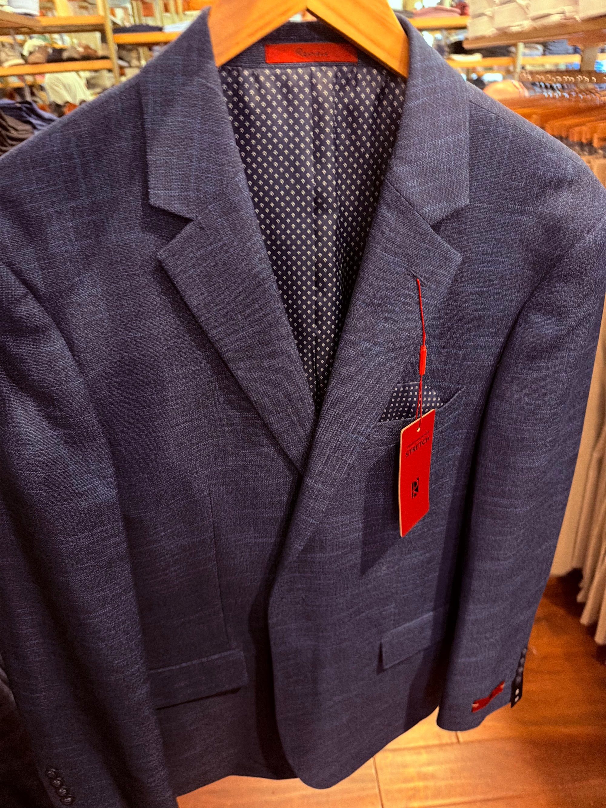 Navy windowpane sport coat on a hanger, picked for a family Christmas card photo at Pawleys Island Men's Store