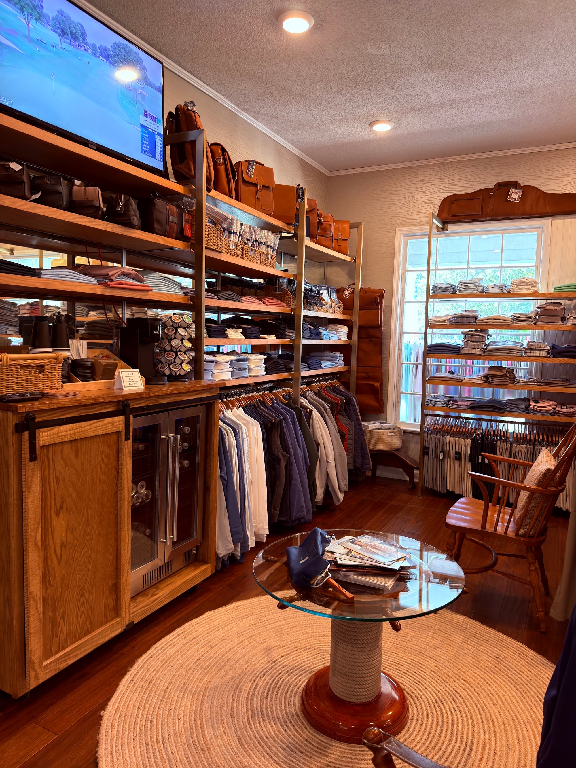 Round display table and new built-in shelving in the remodeled Pawleys Island Men's Store