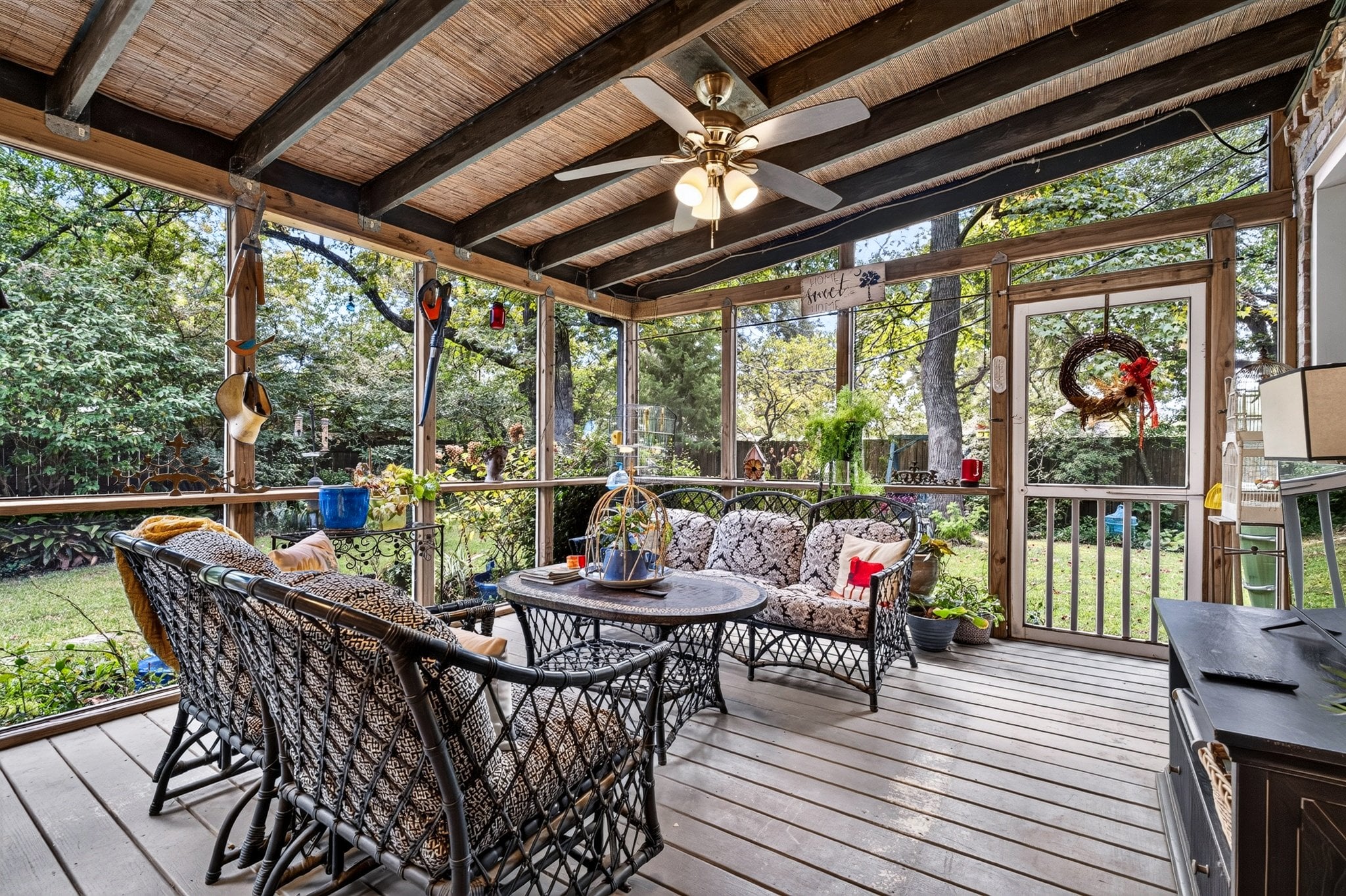 Screened porch with ceiling fans overlooking the garden at 500 Orange St, Georgetown SC