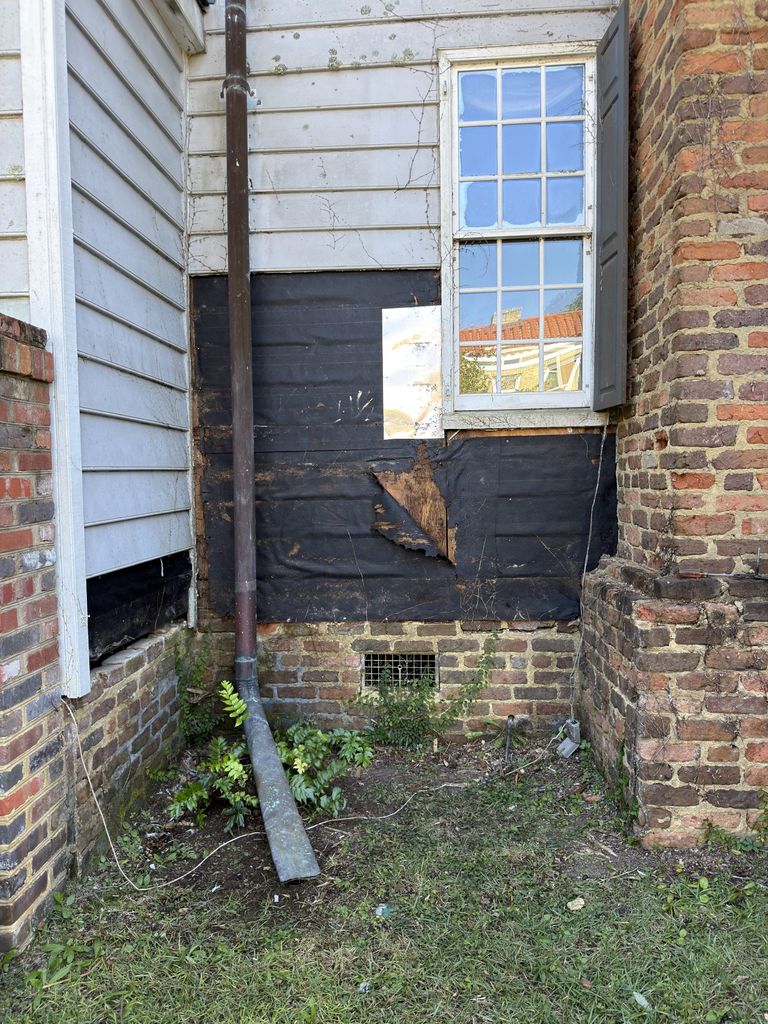 Brick chimney and lower wall on the side of 300 N. Academy Street in Kingstree
