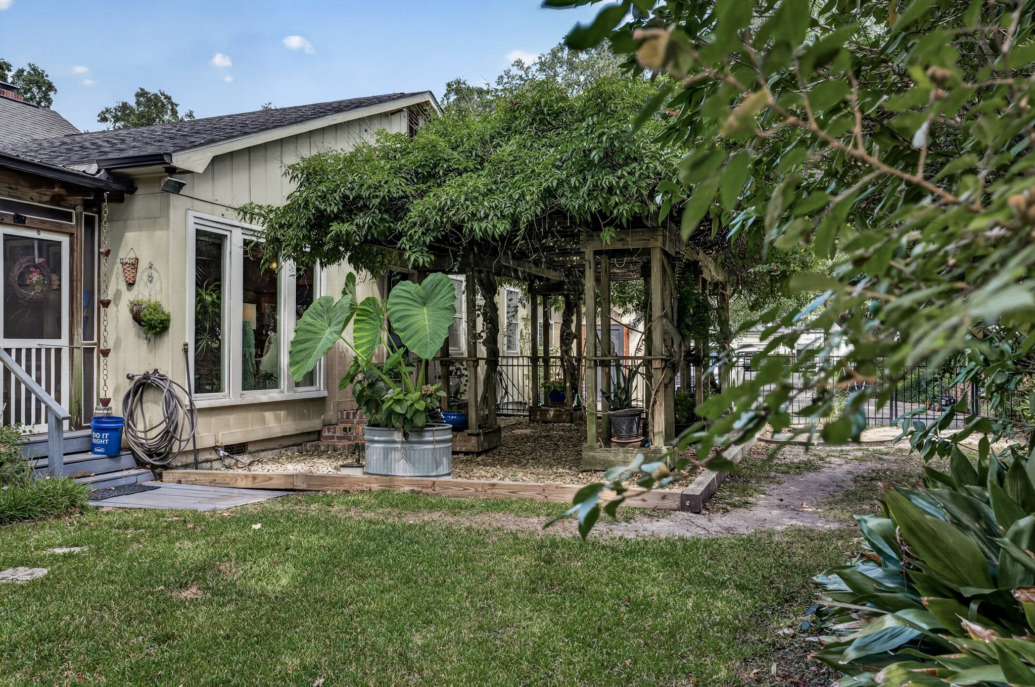Vine-covered pergola and garden courtyard at 500 Orange St, Georgetown SC