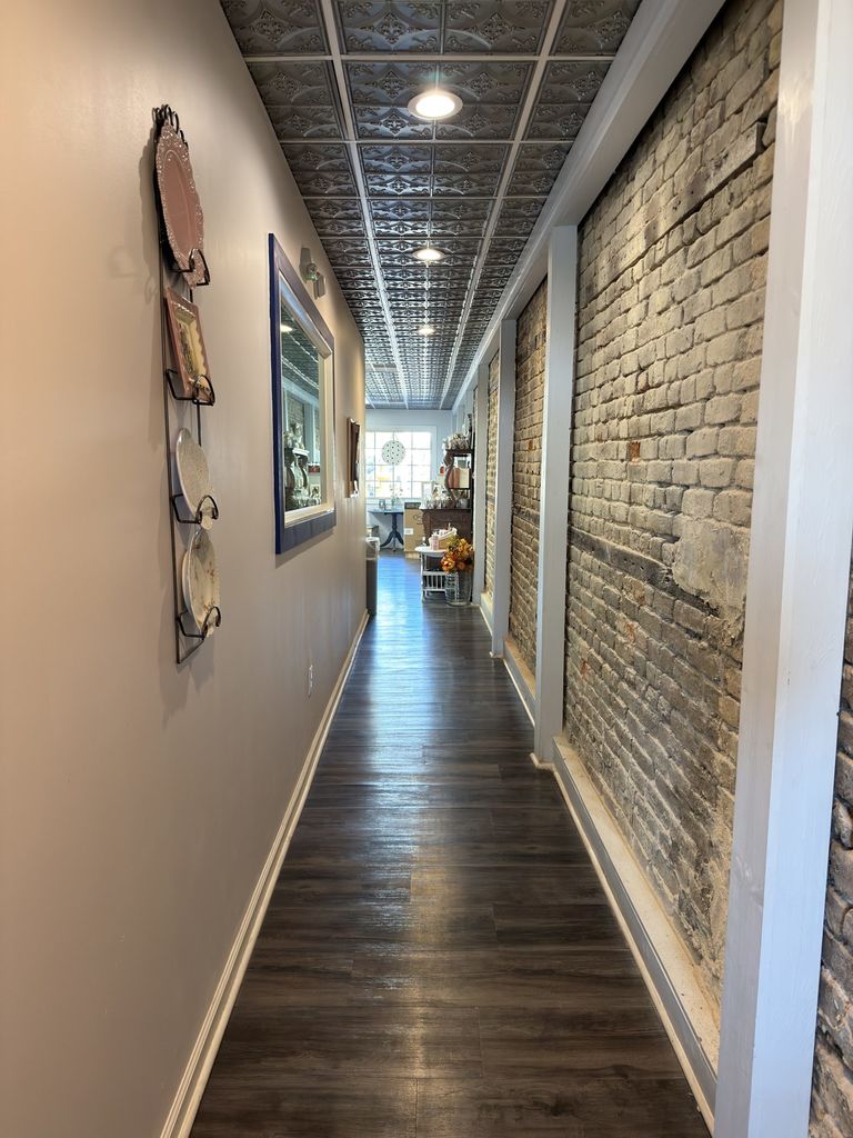 Exposed brick and pressed tin ceiling inside Indigo Bakery, Georgetown SC
