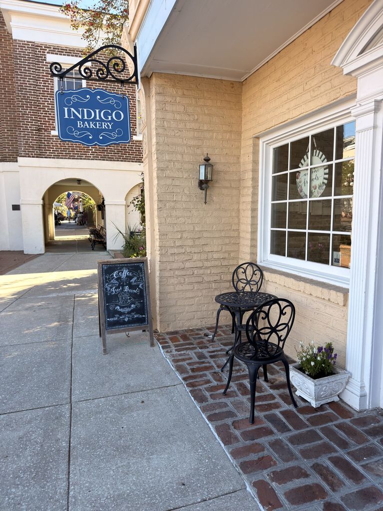 Indigo Bakery sign and sidewalk seating on Front Street, Georgetown SC