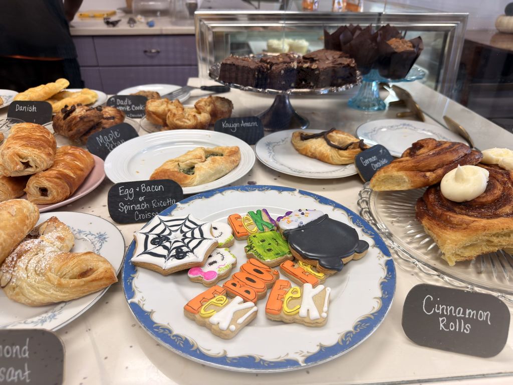 Pastry case with cookies and cinnamon rolls at Indigo Bakery on Front Street, Georgetown