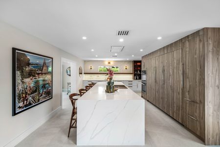 13-Foot quartz waterfall island in kitchen at 3481 NE 18th Avenue Oakland Park FL