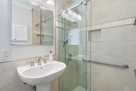 Spa like bathroom with glass enclosed shower