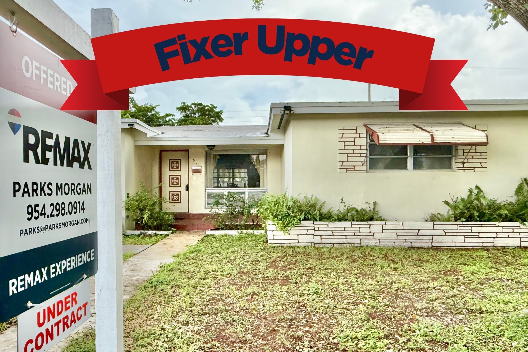 Dated fixer-upper home under contract with a RE/MAX Experience "Offered" yard sign for Realtor Parks Morgan
