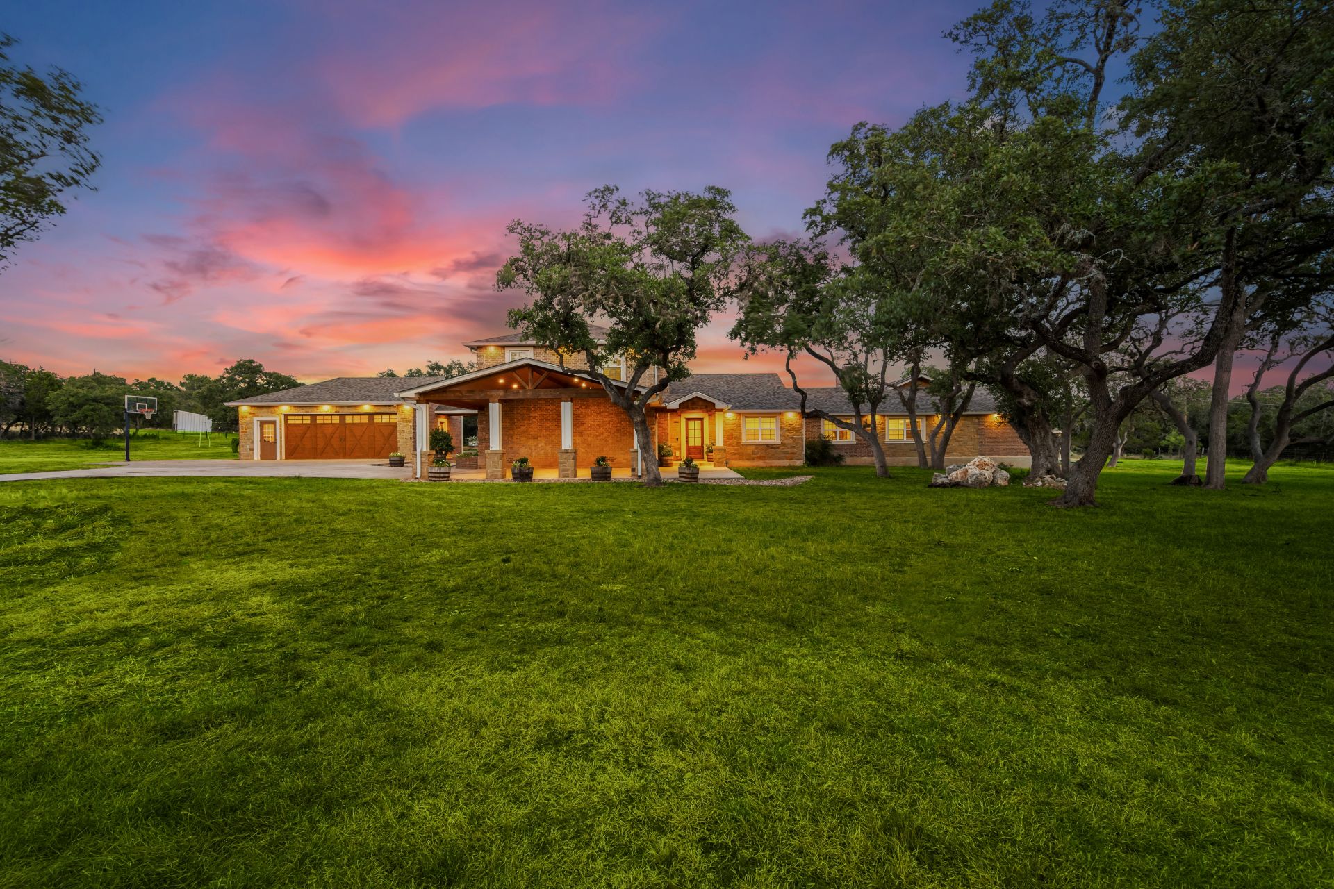 a home at sunset with a green yard