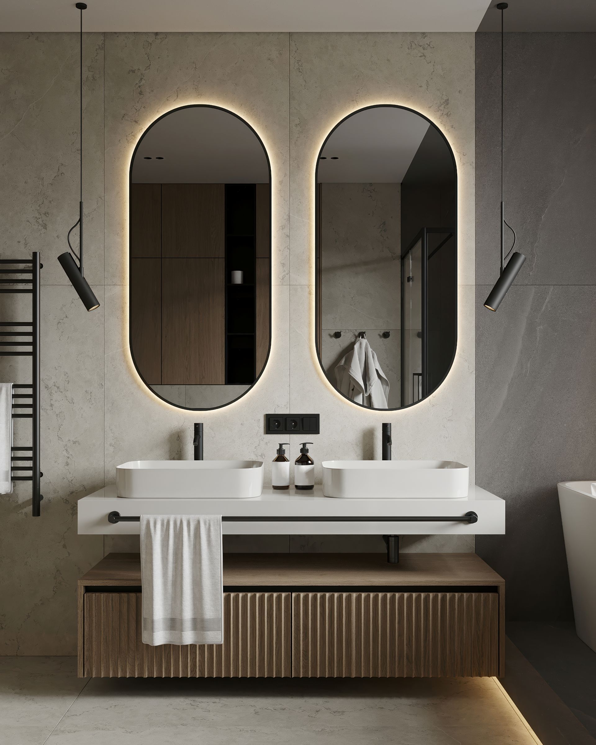 Elegant bathroom with double mirrors, modern sink, and warm lighting.
