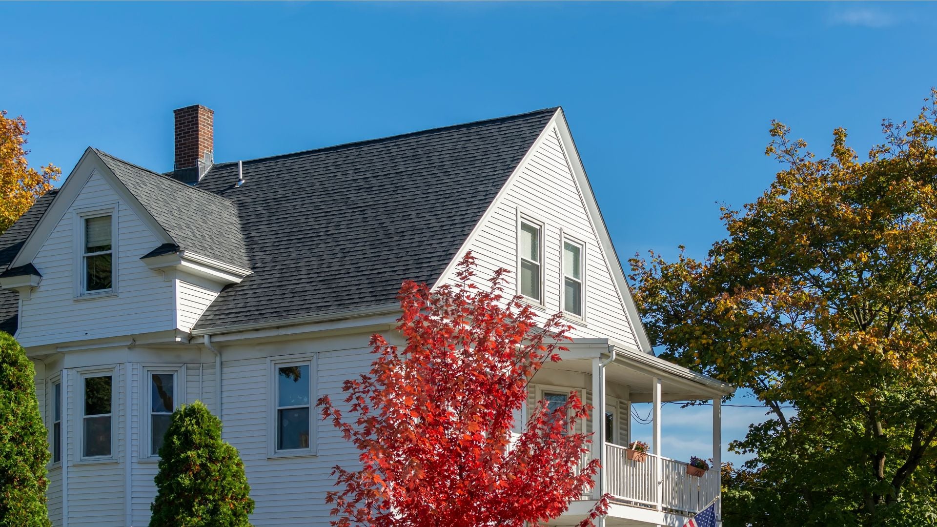 Classic American style two-story home on an autumn clear sky day