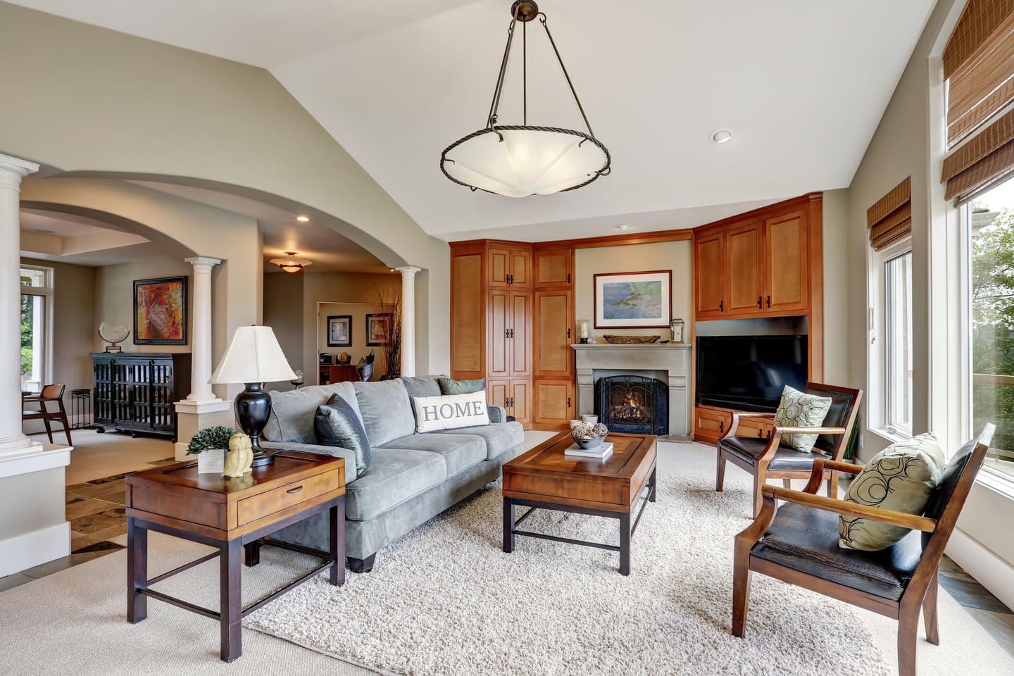 Classic living room interior with large windows, arches and vaulted ceiling in luxurious house. Northwest, USA (1) (1)