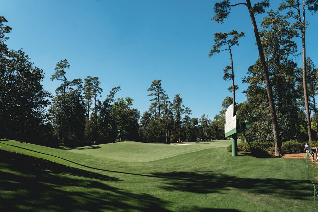 Golf fairway lined with mature trees
