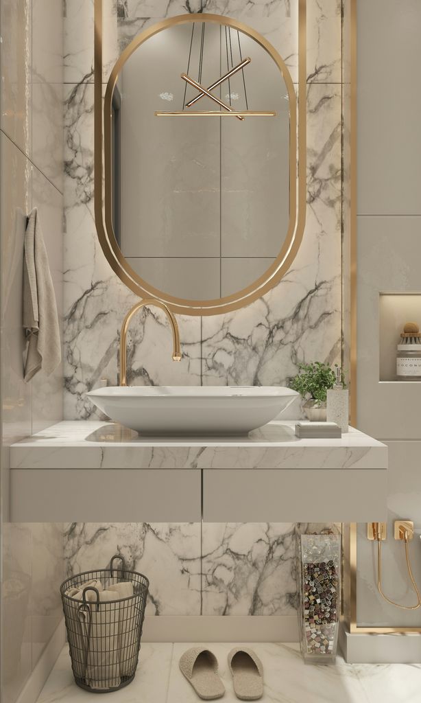 Marble bath with brass fixtures and vessel sink