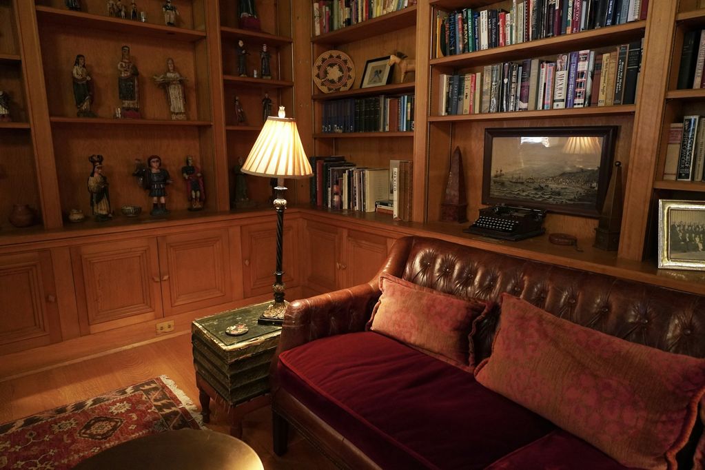 Wood-paneled library with built-in bookcases
