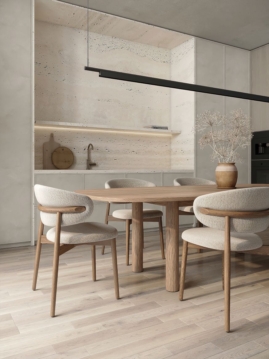 Modern beige kitchen and dining area with contemporary light and chairs