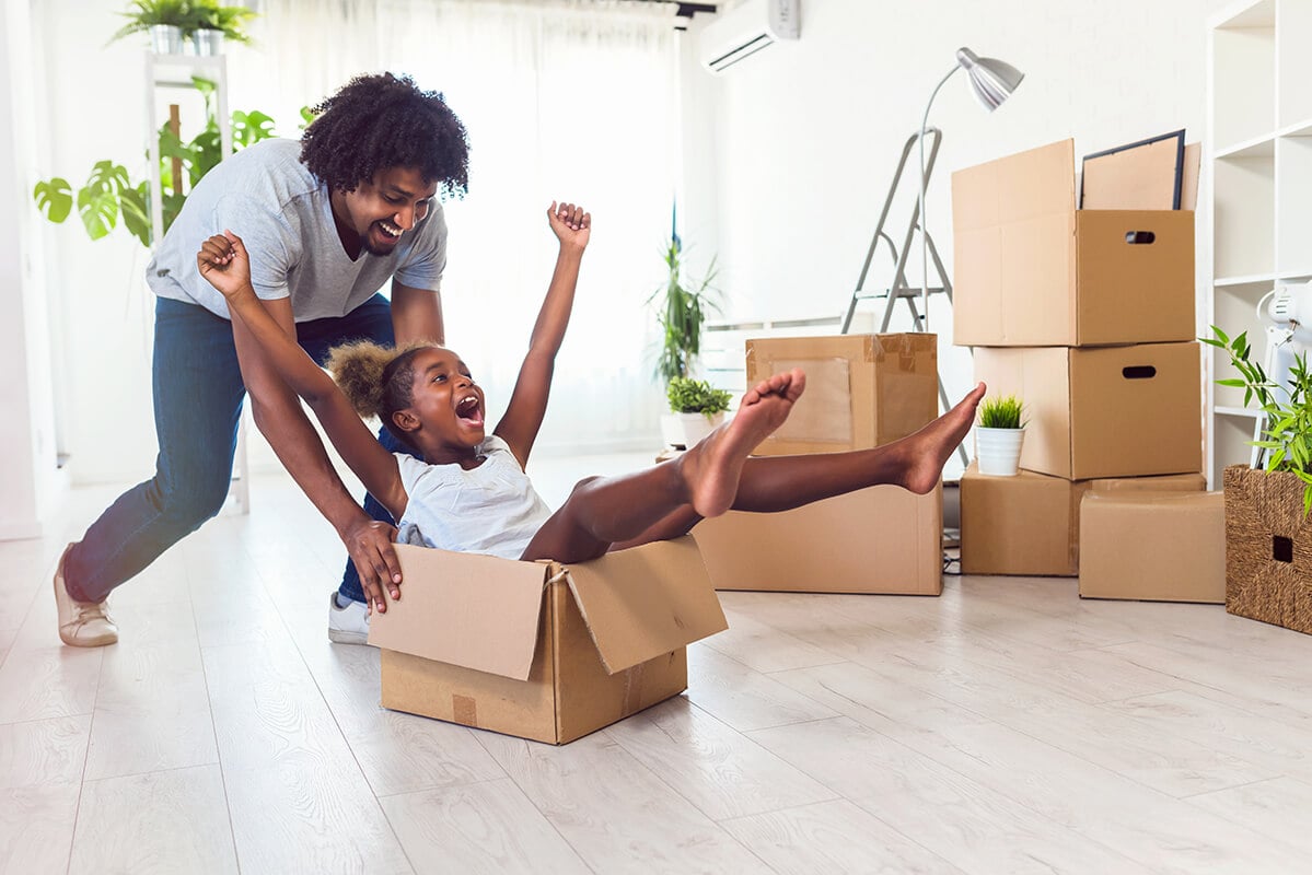Father-push-daughter-in-carton-box