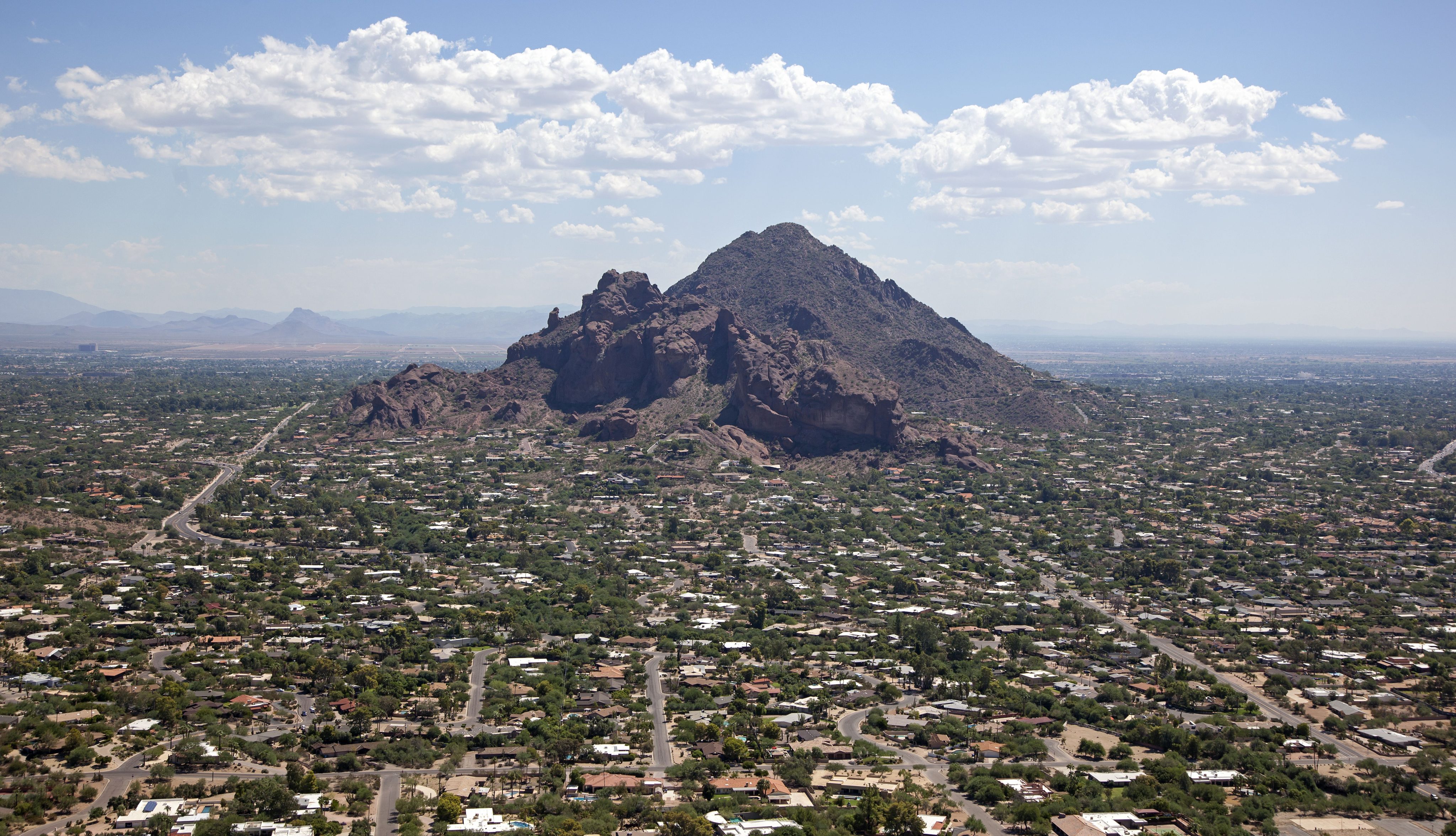 Exclusive living in the area of Camelback Mountain in Phoenix, Arizona as viewed from the air looking east