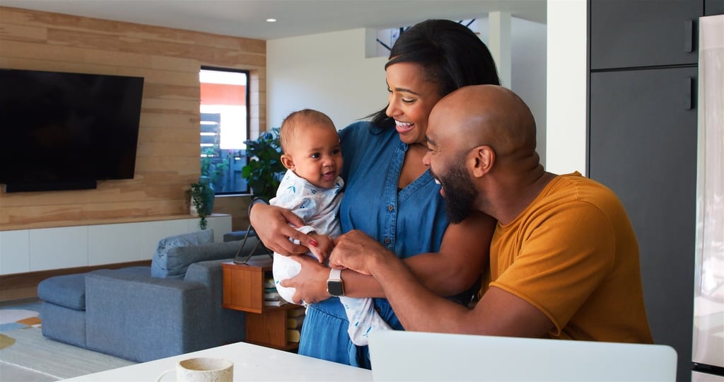 African,American,Family,With,Baby,Daughter,Using,Laptop,To,Check
