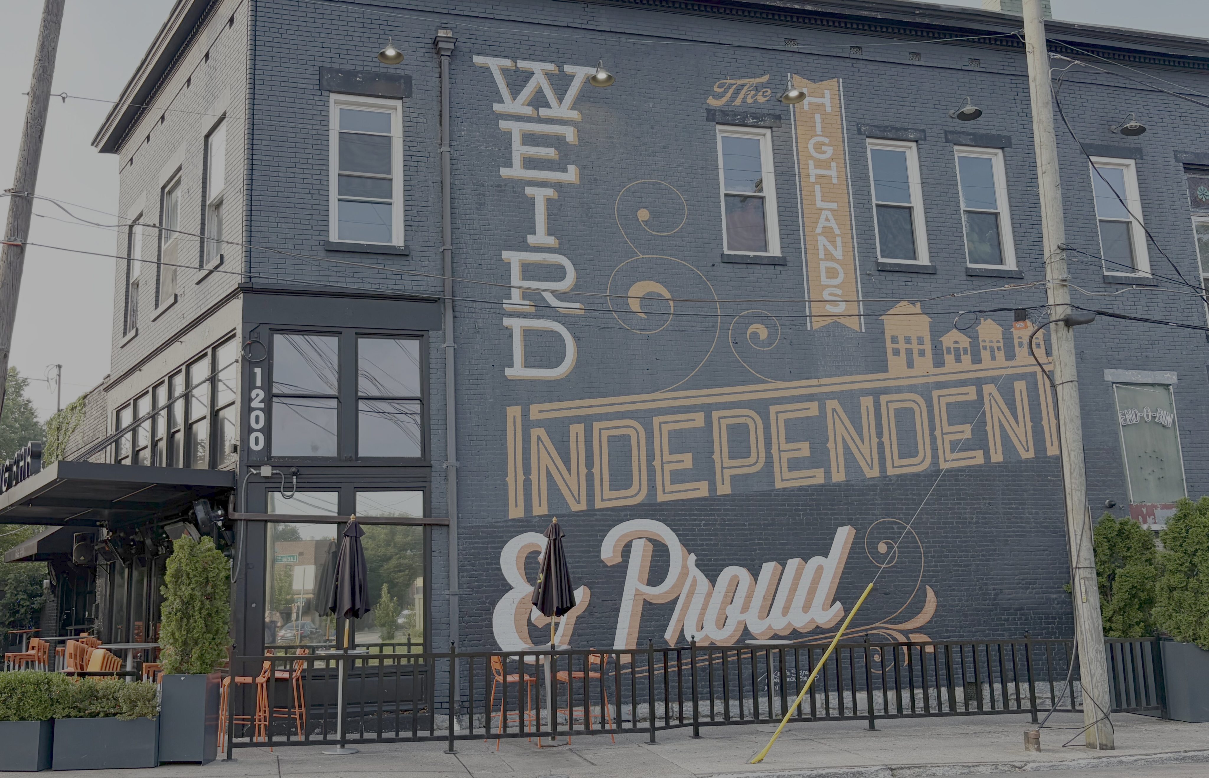 Painted Building with Highlands Art
