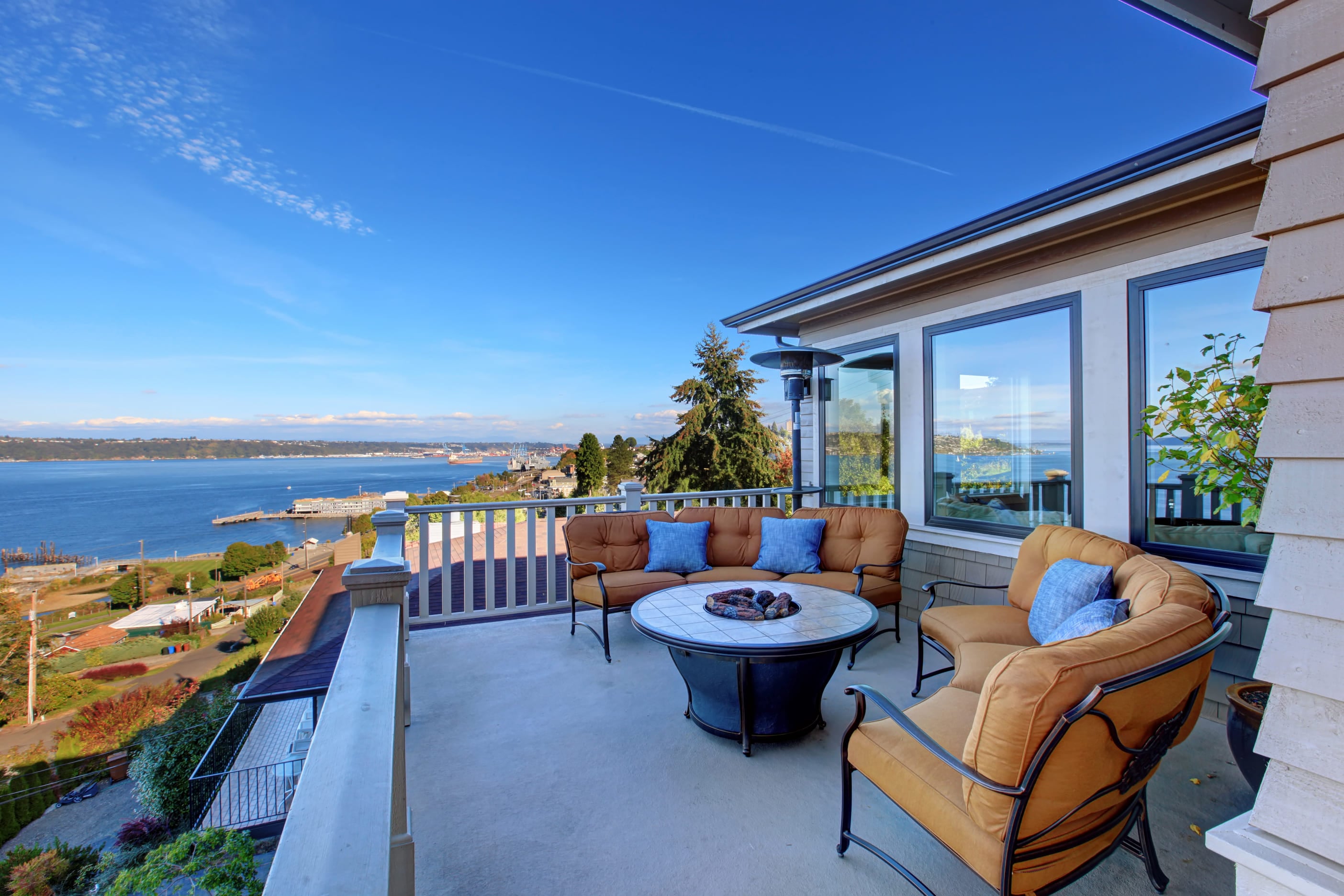 Cozy patio area with comfort settees and fire pit. Deck with Puget Sound view. Tacoma, WA 1 (1) (1)