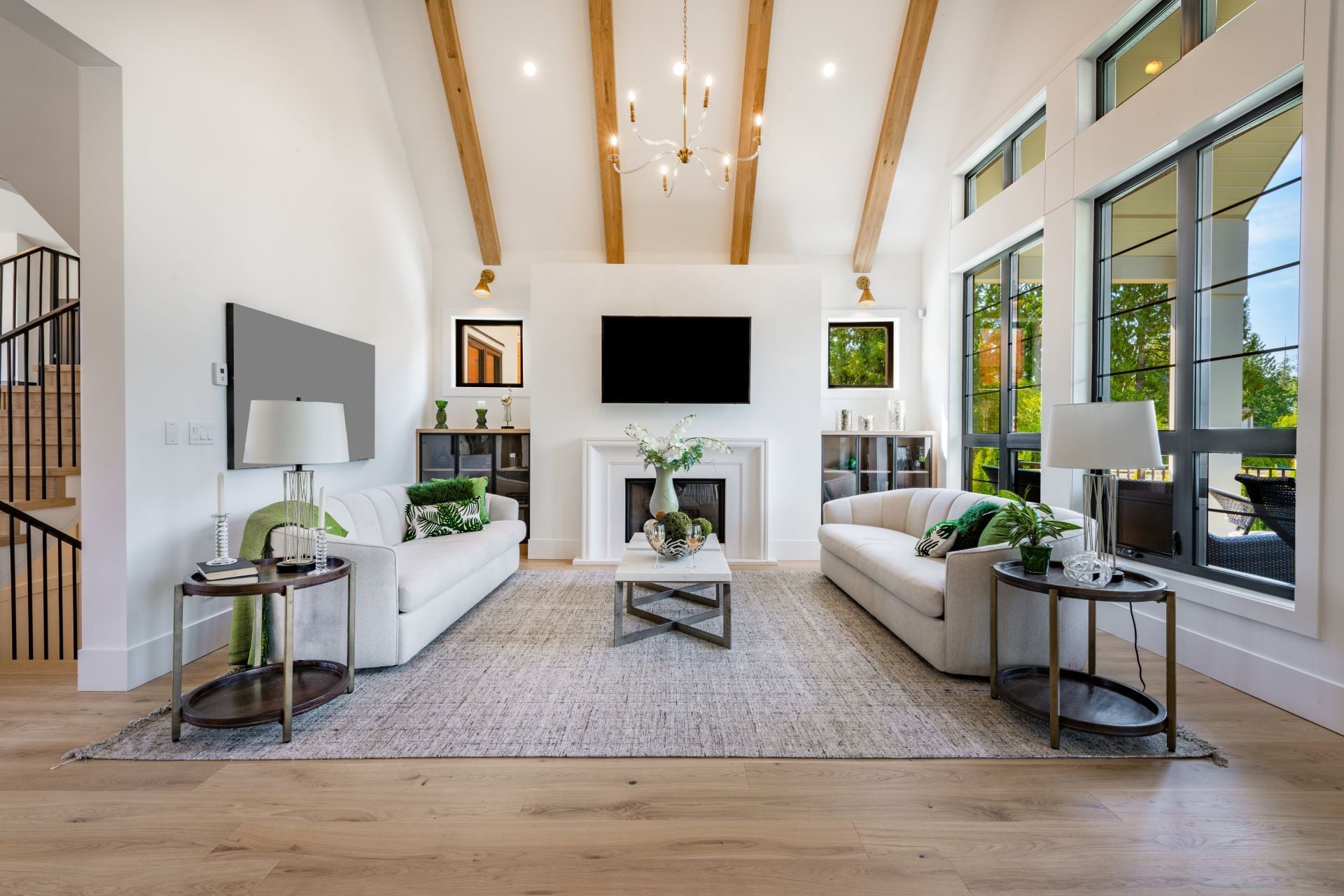 Modern farmhouse style living and family room with large windows cabinets in blues and greens (1)