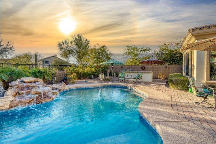 a desert pool at sunset