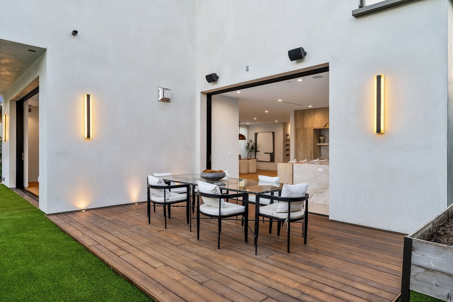 Modern,Outdoor,Patio,With,Wooden,Deck,And,Stylish,Furniture,,Adjacent