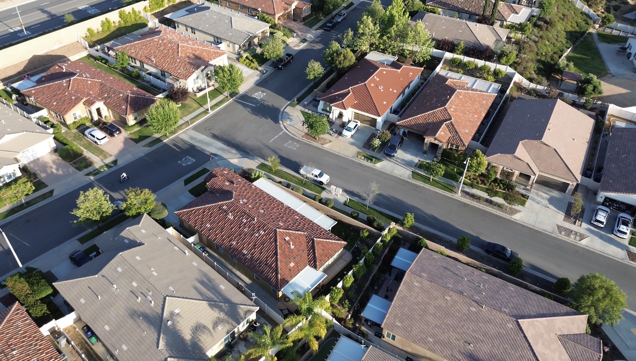 Aerial view of JP Ranch in Yucaipa, California showing Spanish style homes, landscaped streets, and surrounding residential development.
