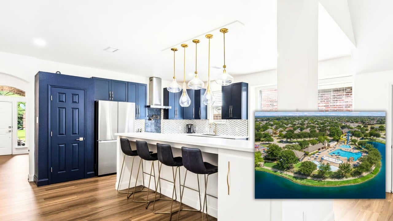 Custom navy kitchen with gold pendant lighting, inset with aerial view of Waterview's lake and waterpark in Rowlett, TX