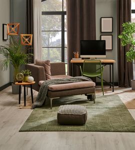 Styled living room with home office nook, plants, and city view