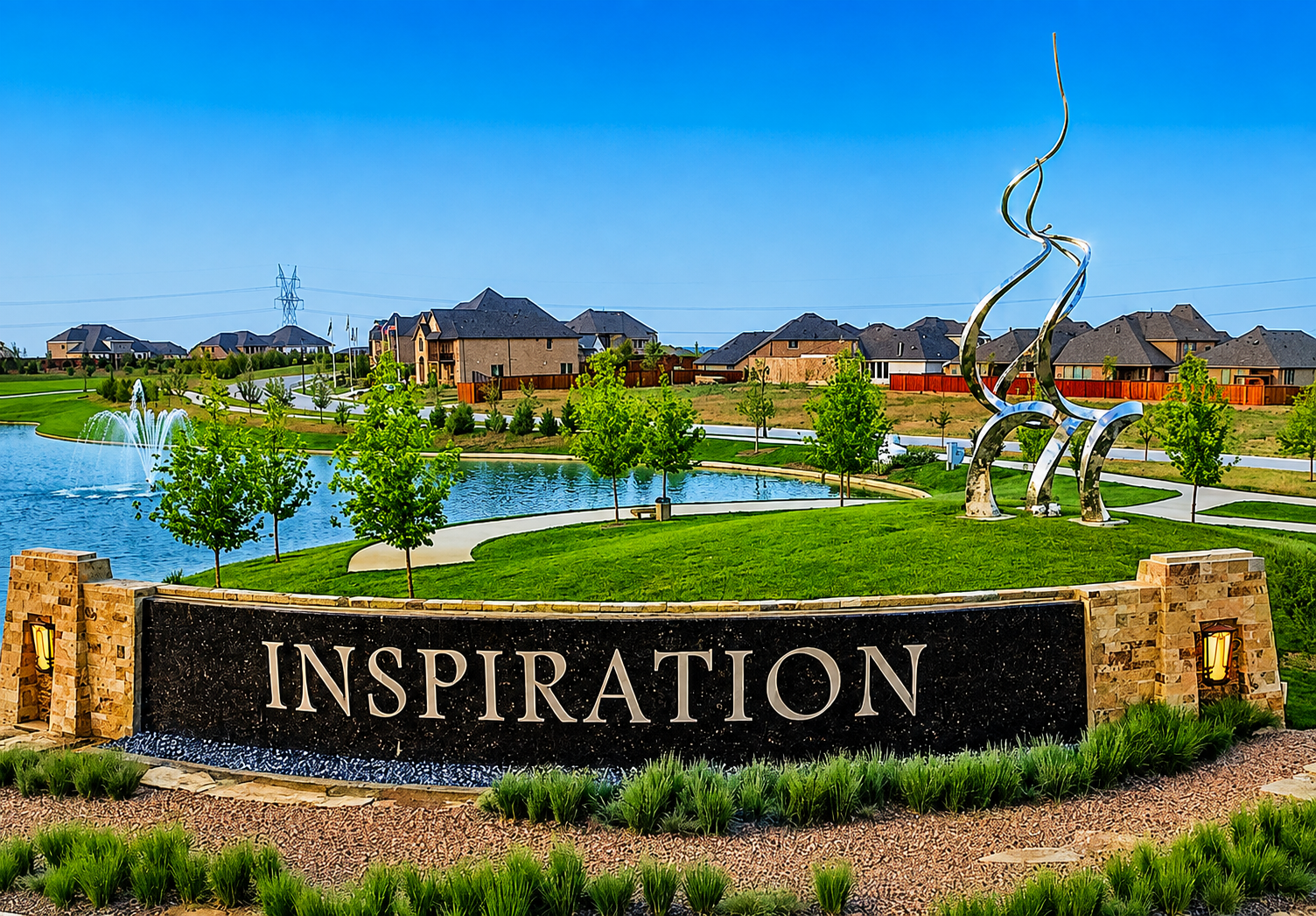 Inspiration community entrance monument with fountain lake and sculpture in Wylie, Texas