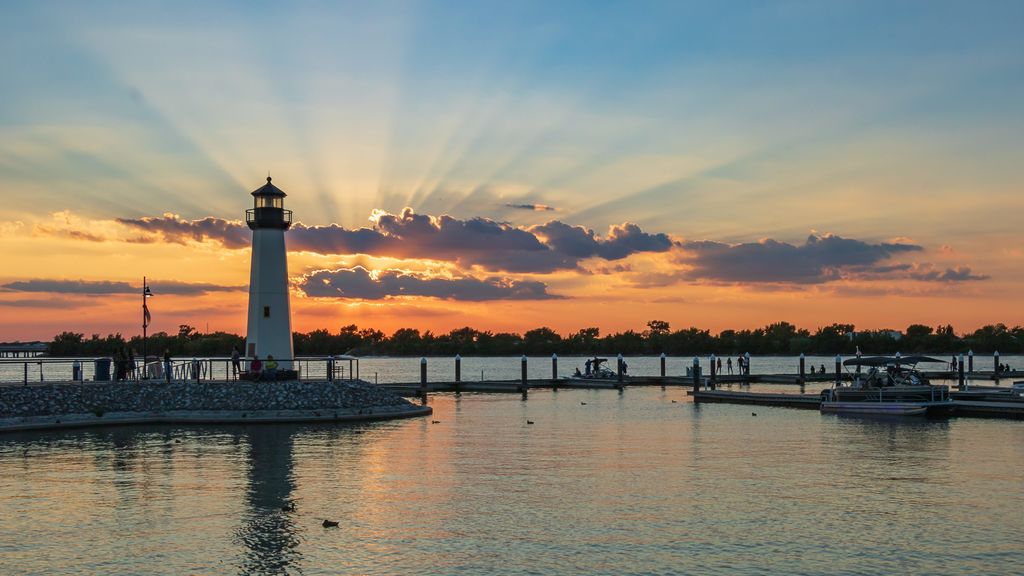 Lighthouse and marina at The Harbor in Rockwall, Texas, at sunset on Lake Ray Hubbard