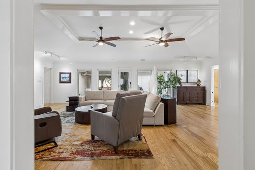 Living room with hardwood floors and ceiling fans | 9020 Glen Springs Dr, Dallas, TX 75243 | Lake Highlands