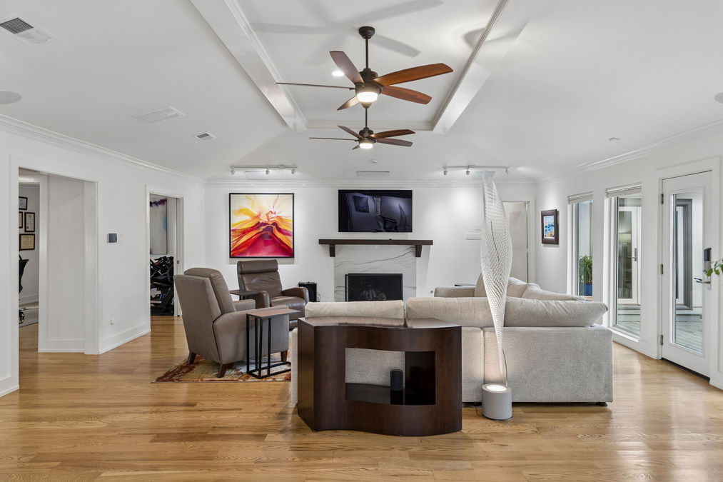 Living room with fireplace and wall of windows | 9020 Glen Springs Dr, Dallas, TX 75243 | Lake Highlands