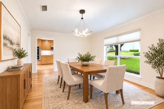 Dining room with chandelier and front window (virtually staged) | 9020 Glen Springs Dr, Dallas, TX 75243 | Lake Highlands