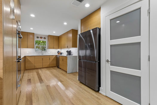 Kitchen with full-height cabinetry and window over the sink | 9020 Glen Springs Dr, Dallas, TX 75243 | Lake Highlands