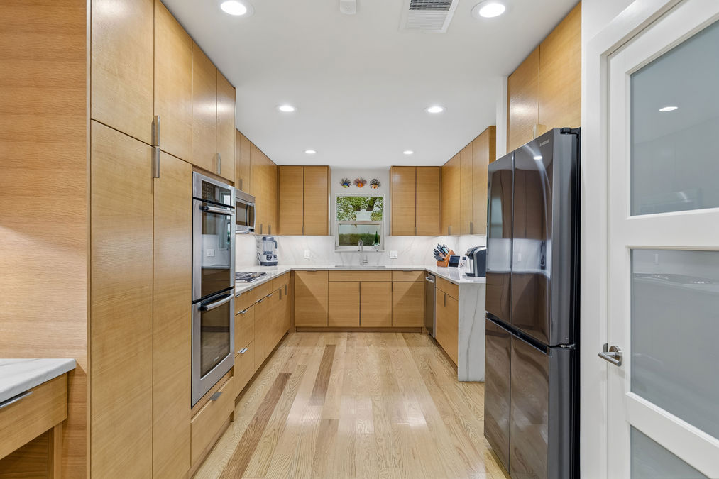 Kitchen with double ovens and full-height cabinetry | 9020 Glen Springs Dr, Dallas, TX 75243 | Lake Highlands