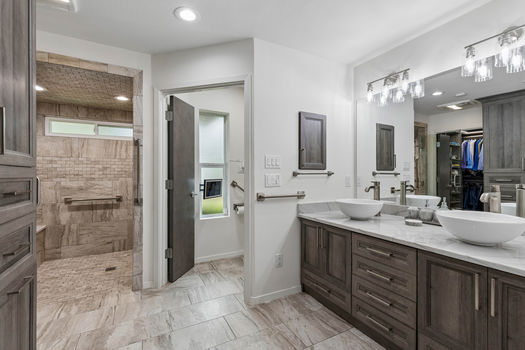 Primary bath with double vanity and walk-in shower | 9020 Glen Springs Dr, Dallas, TX 75243 | Lake Highlands