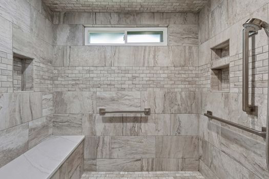Primary bath walk-in shower with built-in bench | 9020 Glen Springs Dr, Dallas, TX 75243 | Lake Highlands