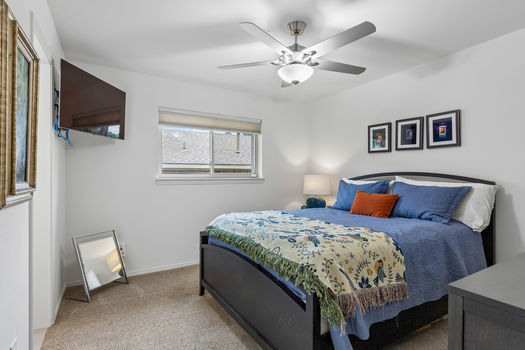 Bedroom with ceiling fan and natural light | 9020 Glen Springs Dr, Dallas, TX 75243 | Lake Highlands