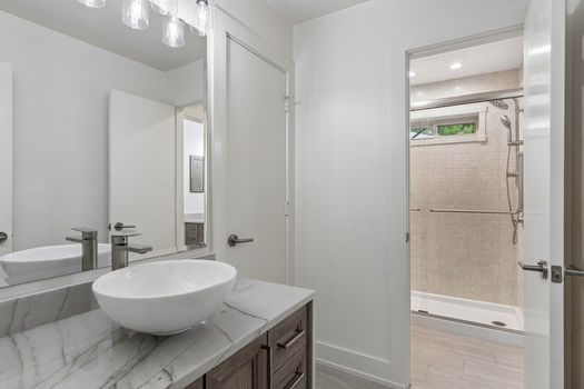 Bathroom with vessel sink and walk-in shower | 9020 Glen Springs Dr, Dallas, TX 75243 | Lake Highlands