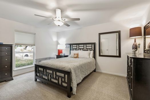 Bedroom with ceiling fan and front window | 9020 Glen Springs Dr, Dallas, TX 75243 | Lake Highlands