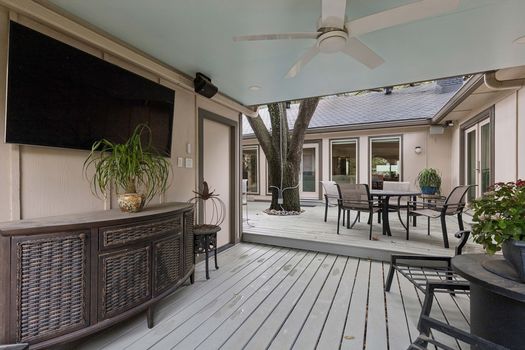 Covered outdoor living area with TV | 9020 Glen Springs Dr, Dallas, TX 75243 | Lake Highlands
