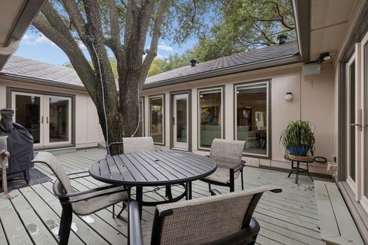 Courtyard deck with French doors to the home | 9020 Glen Springs Dr, Dallas, TX 75243 | Lake Highlands