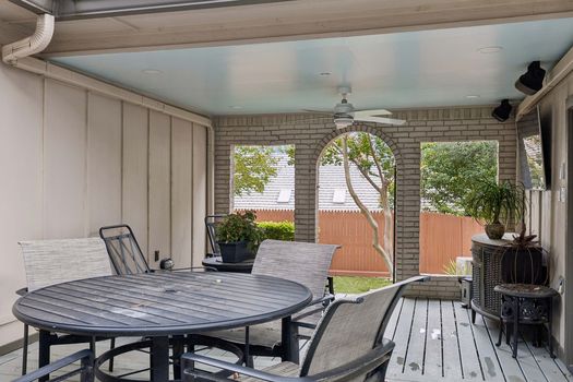 Covered patio with brick arches and dining area | 9020 Glen Springs Dr, Dallas, TX 75243 | Lake Highlands
