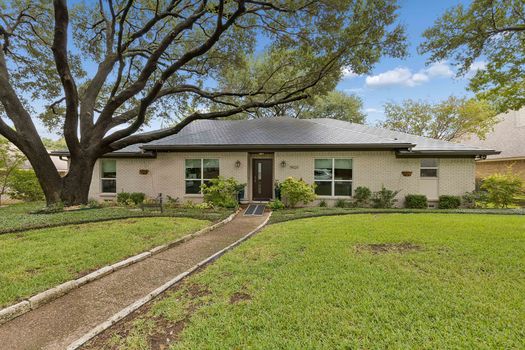 Front exterior with walkway and mature trees | 9020 Glen Springs Dr, Dallas, TX 75243 | Lake Highlands